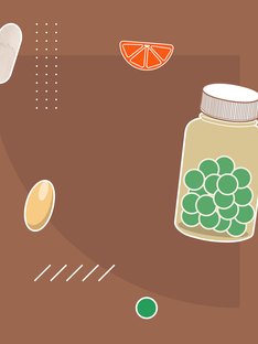 Colorful variety of vitamin and supplement pills on a brown background