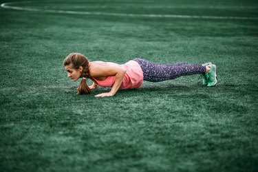 woman doing burpees for at-home crossfit amrap workout
