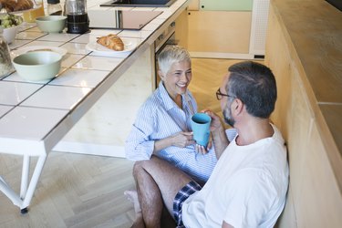 man and woman sitting on the floor