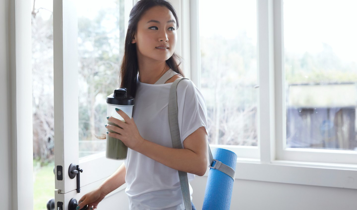 Woman drinking smoothie living well